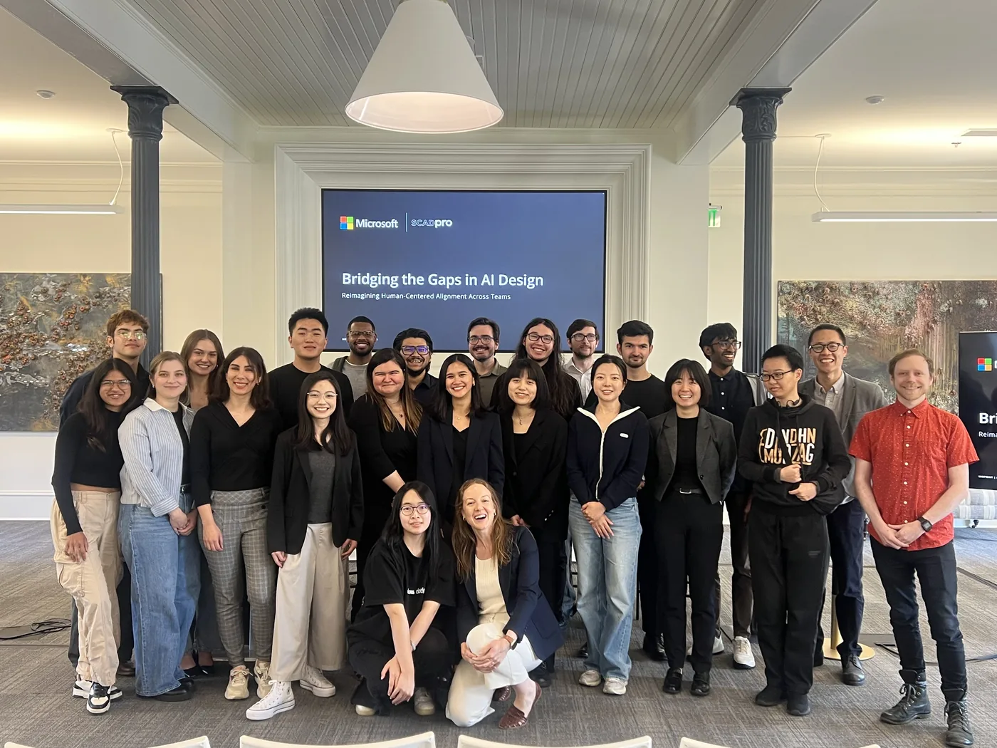 The Microsoft and SCADpro team in front of the Bridging the Gaps in AI Design presentation.