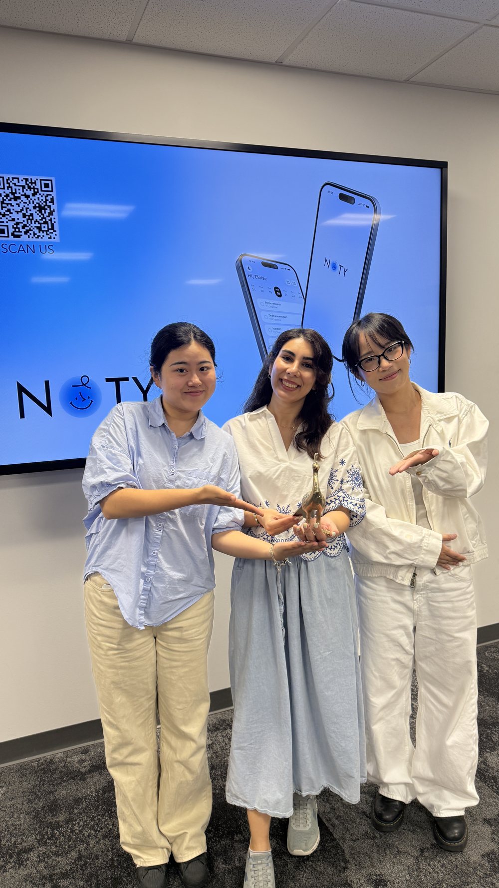 The team holding their award